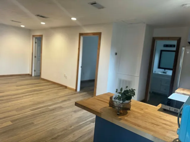 a view of kitchen with granite countertop window and sink