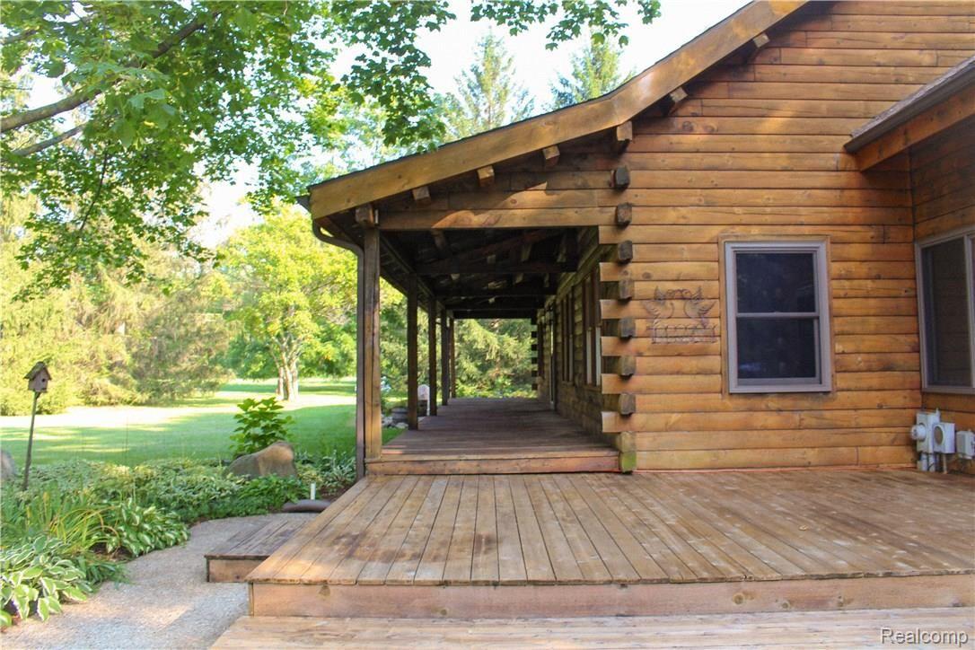 4165 Morgan Road Lake Orion, MI 48359 - Photo 6 of 81 Lot's of cedar deck space in front and back of the home. Perfect place to entertain.