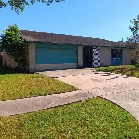 a house with yard in front of it