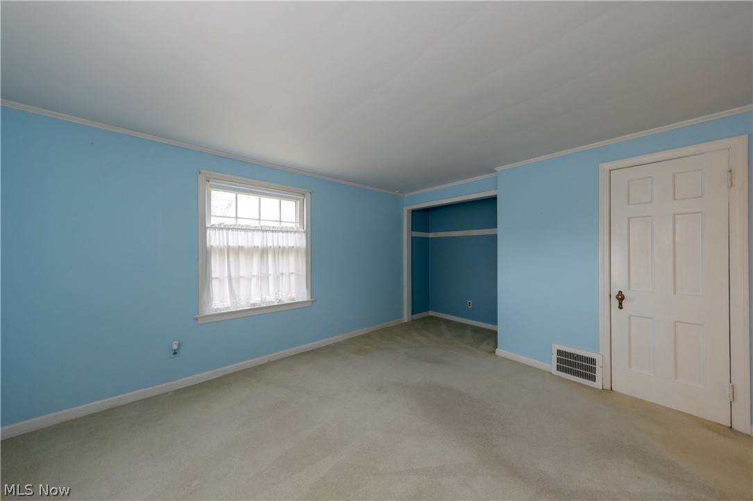 1050 Renfield Road Cleveland Heights, OH 44121 - Photo 30 of 41 Carpeted empty bedroom with ornamental molding