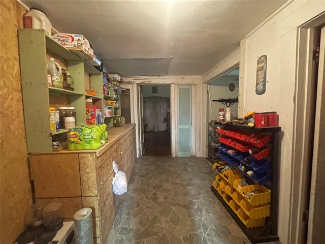 a view of a house with a yard and sitting area