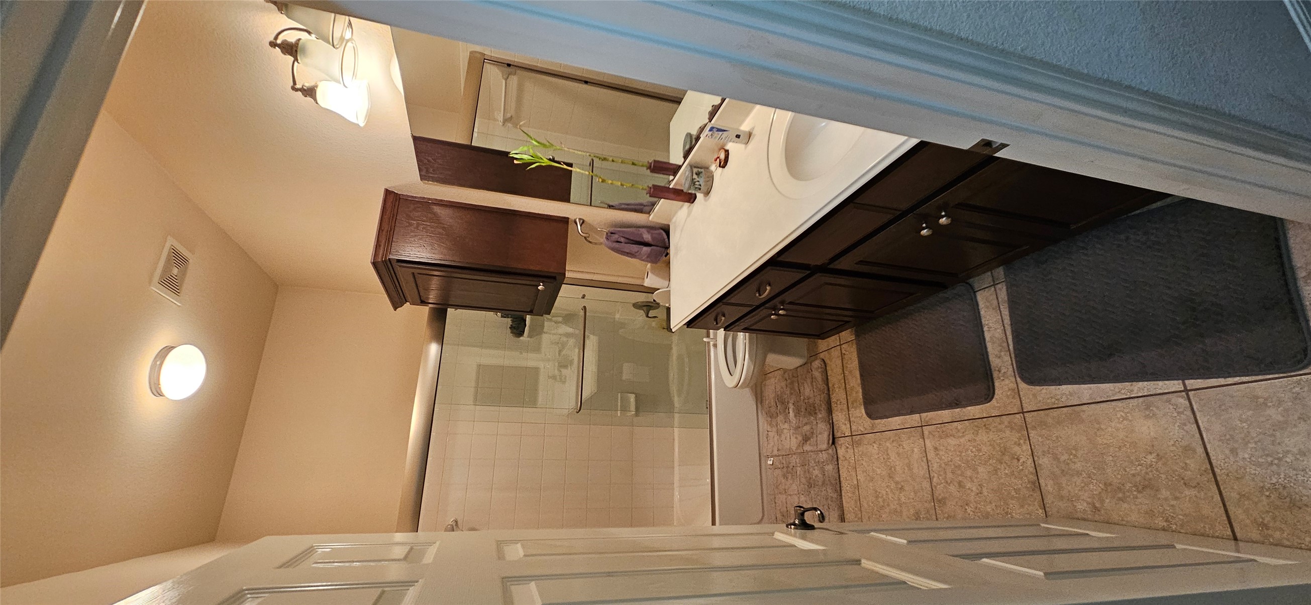 116 Azimuth Drive Austin, TX 78717 - Photo 2 of 33 a bathroom with a sink and mirror