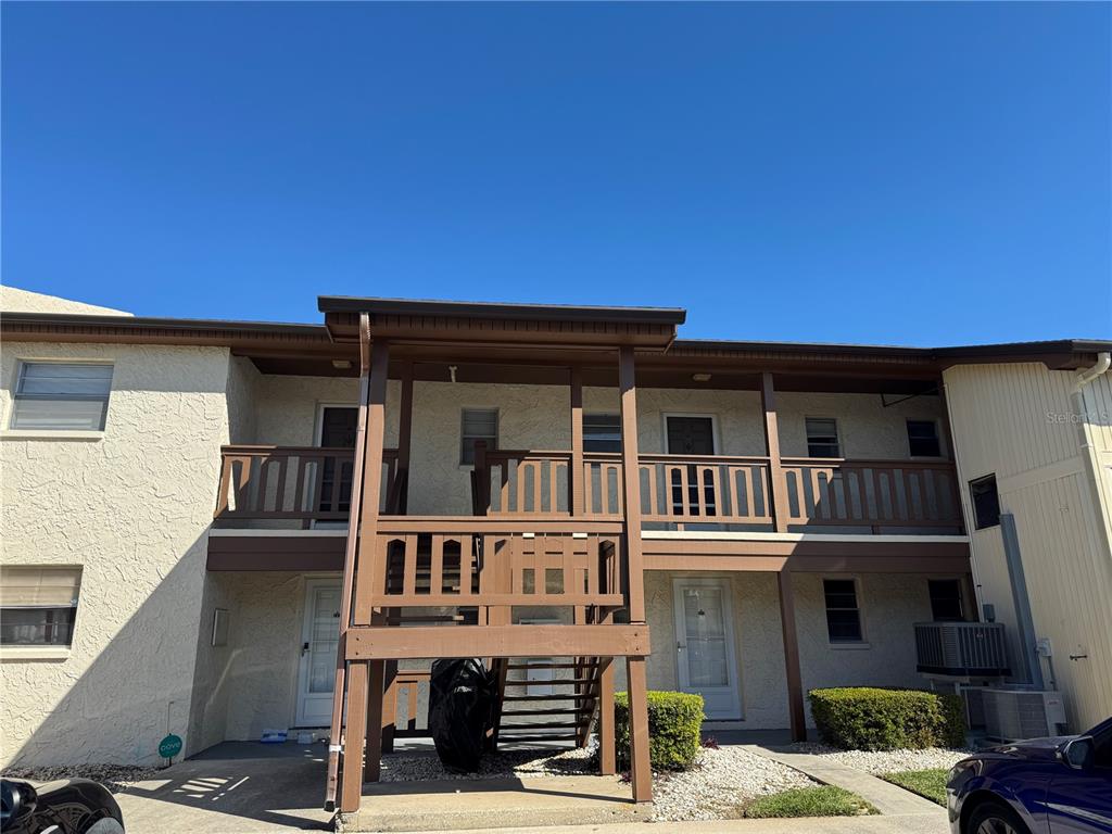 5154 Turquoise Lane, Unit 102 New Port Richey, FL 34652 - Photo 2 of 11 front view of a building