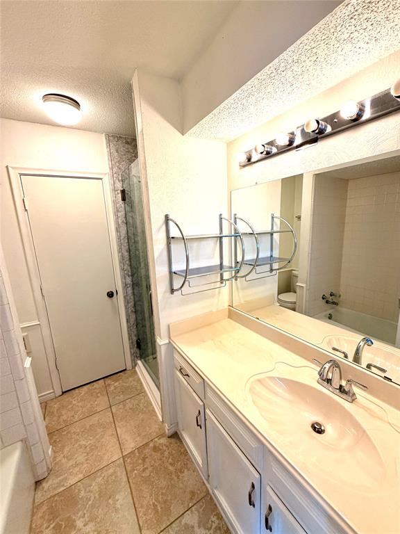 2018 Tree House Lane Plano, TX 75023 - Photo 11 of 15 a bathroom with a sink and a mirror