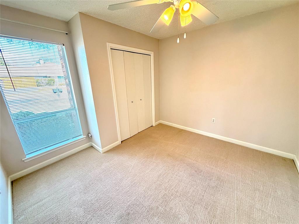 2018 Tree House Lane Plano, TX 75023 - Photo 12 of 15 an empty room with a mirror