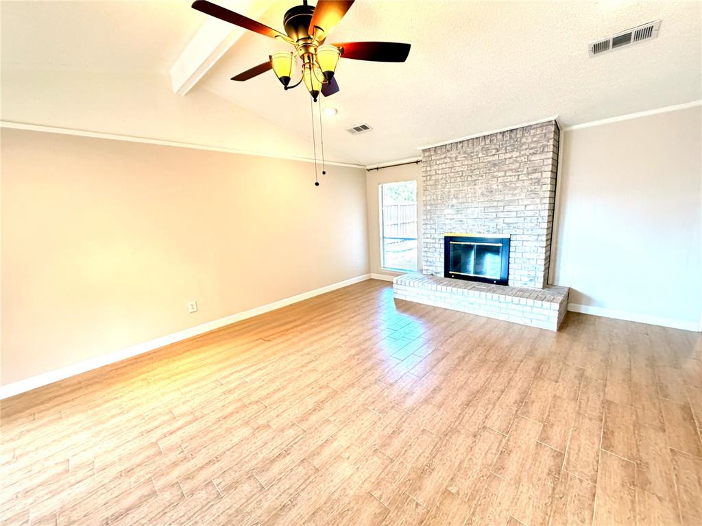2018 Tree House Lane Plano, TX 75023 - Photo 5 of 15 a view of empty room with wooden floor and fan