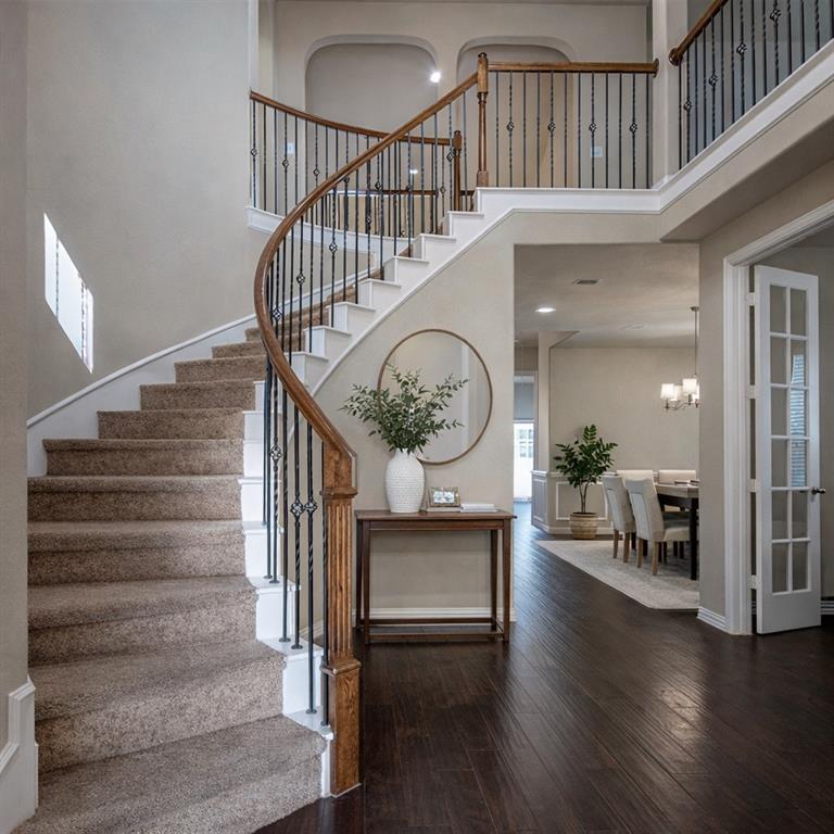 a view of entryway livingroom and hall with wooden floor
