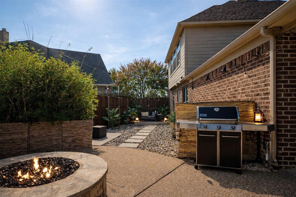 1398 Ranch Gate Lane Frisco, TX 75036 - Photo 24 of 35 Outdoor patio grill, fire pit, zero-scaped area