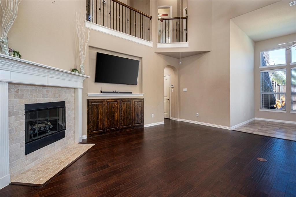 1398 Ranch Gate Lane Frisco, TX 75036 - Photo 8 of 36 Living Room, open to breakfast area and kitchen