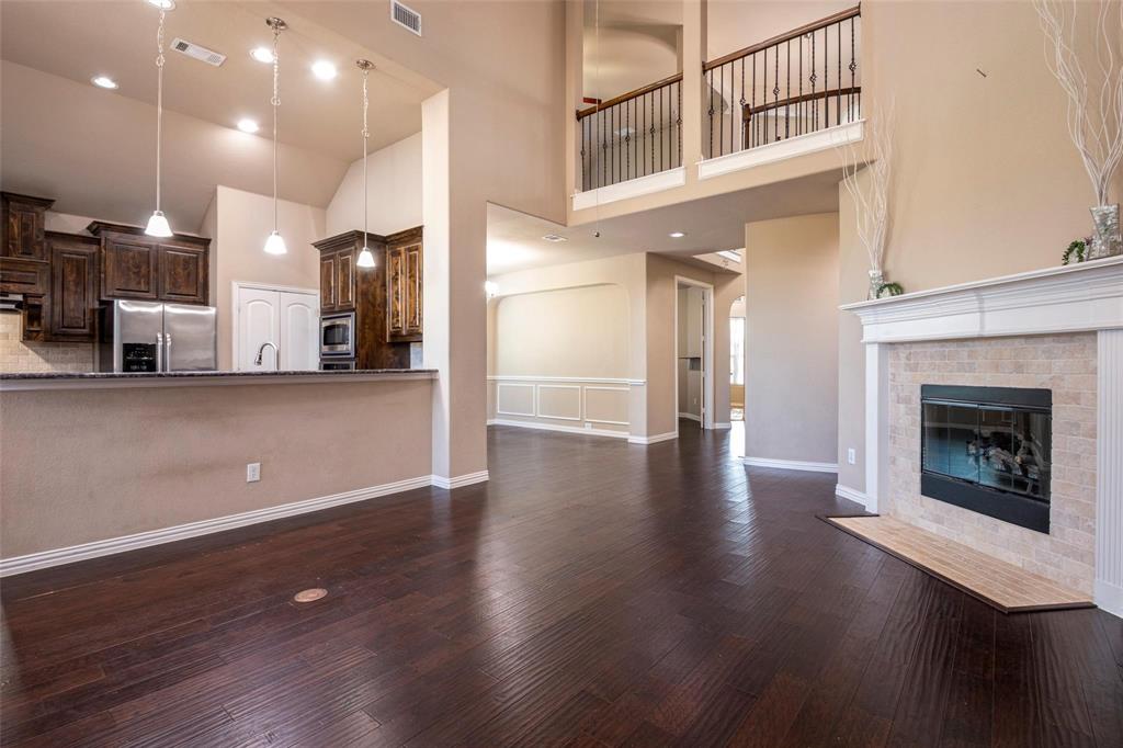 1398 Ranch Gate Lane Frisco, TX 75036 - Photo 9 of 36 Living Room, open to breakfast area and kitchen