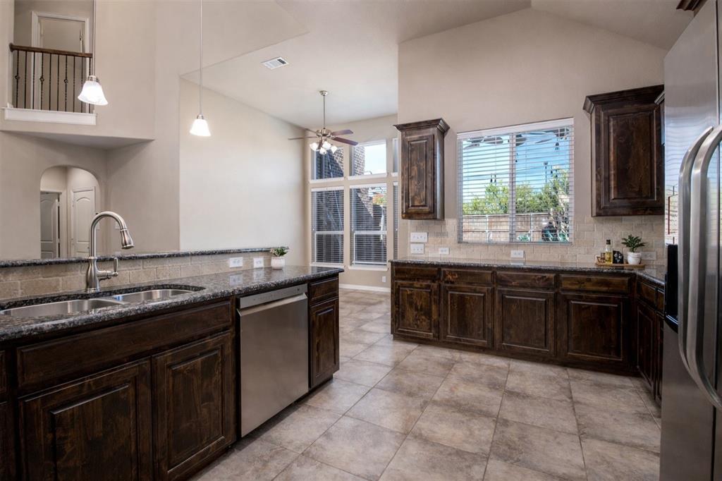 1398 Ranch Gate Lane Frisco, TX 75036 - Photo 10 of 35 Kitchen , SS app ,open to breakfast and living and dining, bar top