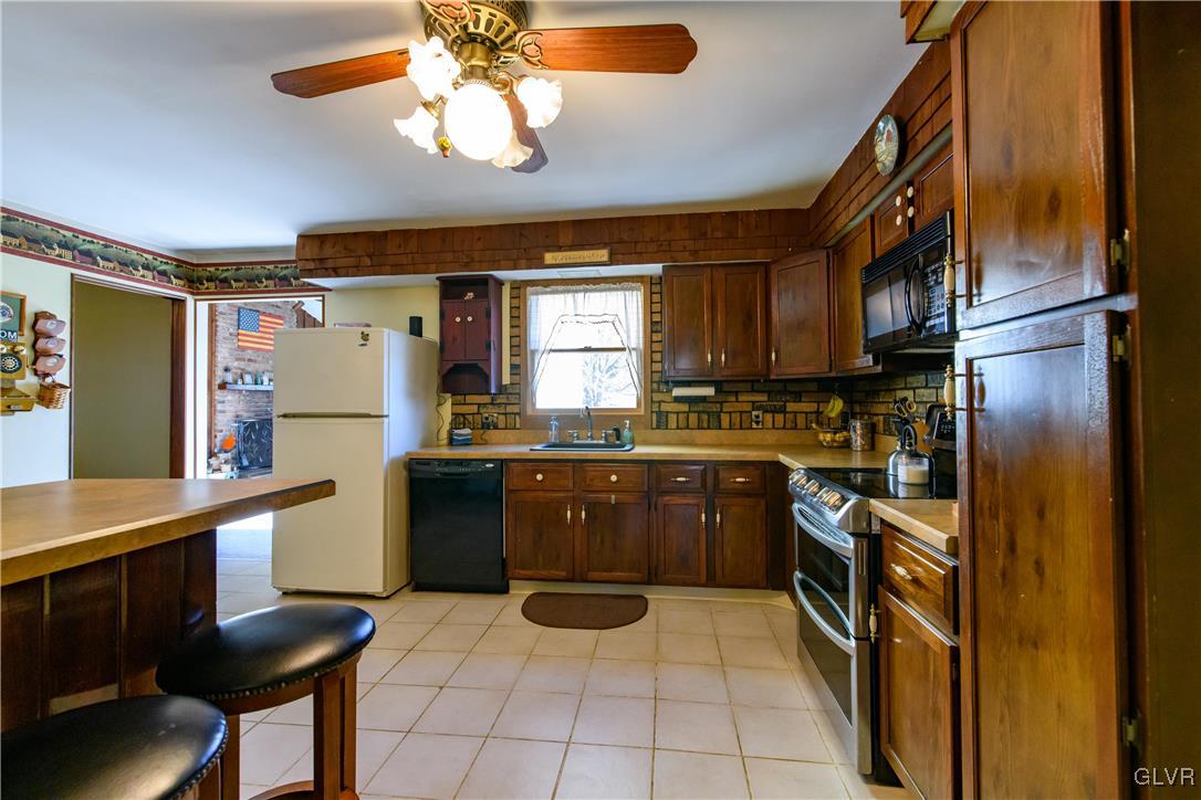 3 Koeck Road Columbia, NJ 07832 - Photo 11 of 23 a kitchen with stainless steel appliances granite countertop a refrigerator and a stove top oven