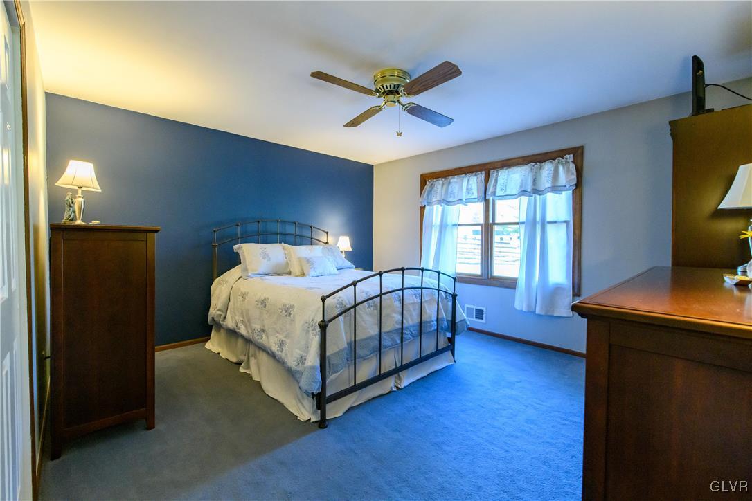 3 Koeck Road Columbia, NJ 07832 - Photo 15 of 23 a bedroom with a bed and a chandelier