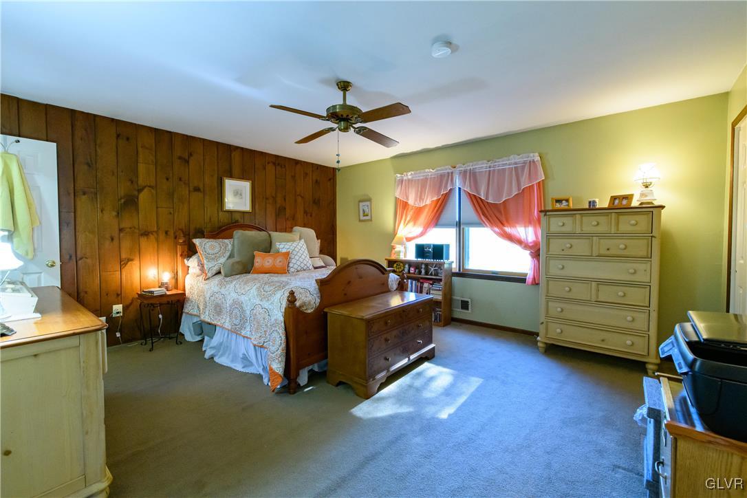3 Koeck Road Columbia, NJ 07832 - Photo 16 of 23 a bedroom with a bed and a chandelier