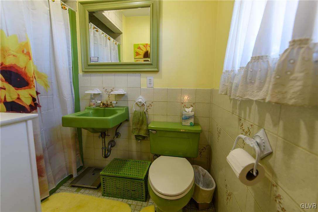 3 Koeck Road Columbia, NJ 07832 - Photo 18 of 23 a bathroom with a toilet sink and mirror