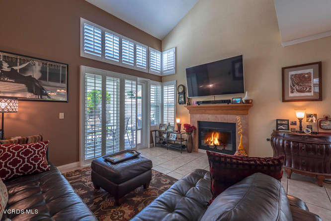 40 Valley Crest Road Simi Valley, CA 93065 - Photo 13 of 38 a living room with furniture a flat screen tv and a fireplace