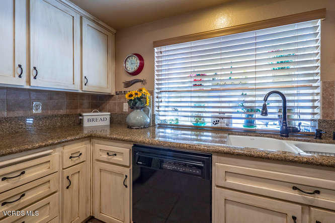 40 Valley Crest Road Simi Valley, CA 93065 - Photo 16 of 38 a kitchen with appliances cabinets and a window