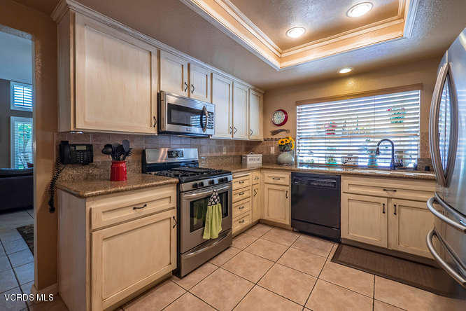 40 Valley Crest Road Simi Valley, CA 93065 - Photo 3 of 38 a kitchen with stainless steel appliances granite countertop a stove sink and cabinets