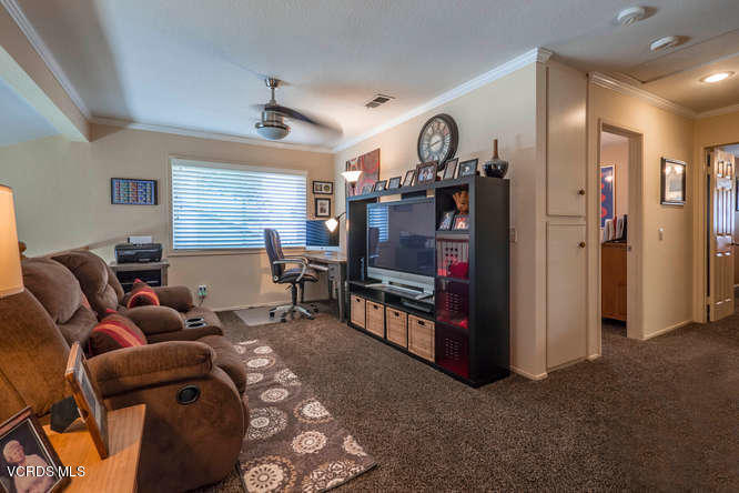 40 Valley Crest Road Simi Valley, CA 93065 - Photo 30 of 38 a living room with furniture and a flat screen tv