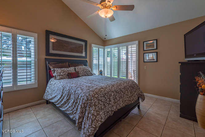 40 Valley Crest Road Simi Valley, CA 93065 - Photo 4 of 38 a bedroom with a bed and a chandelier