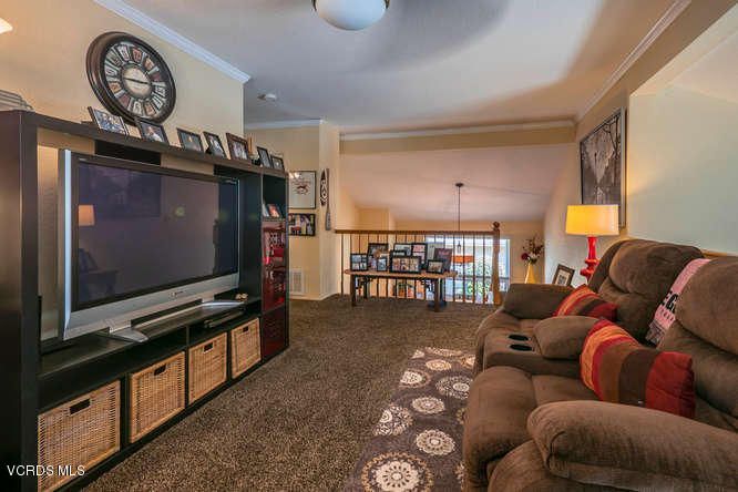 40 Valley Crest Road Simi Valley, CA 93065 - Photo 32 of 38 a living room with furniture a flat screen tv and a window