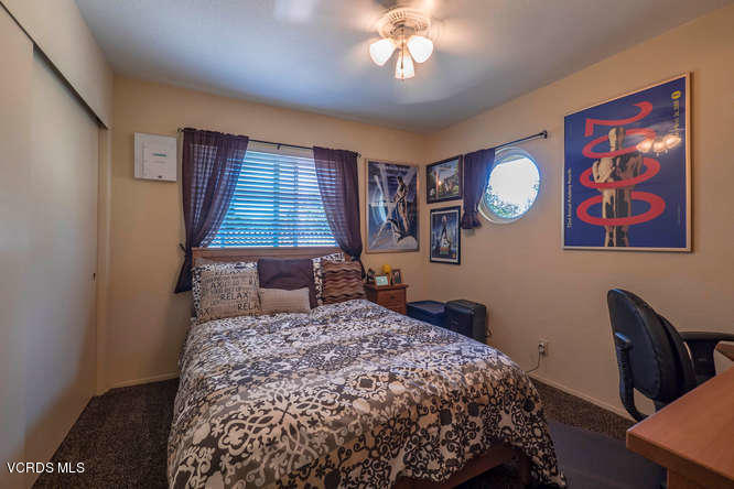 40 Valley Crest Road Simi Valley, CA 93065 - Photo 33 of 38 a bedroom with a bed and wooden floor