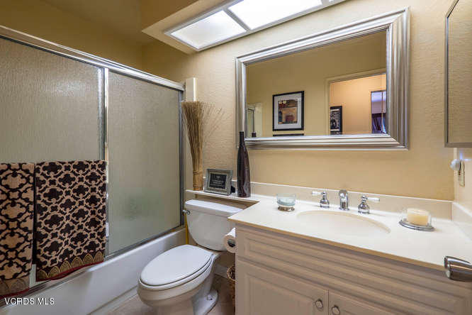 40 Valley Crest Road Simi Valley, CA 93065 - Photo 34 of 38 a bathroom with a sink a mirror a toilet and shower