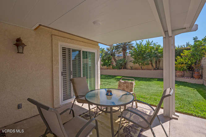 40 Valley Crest Road Simi Valley, CA 93065 - Photo 36 of 38 a view of a patio with table and chairs potted plants with wooden floor