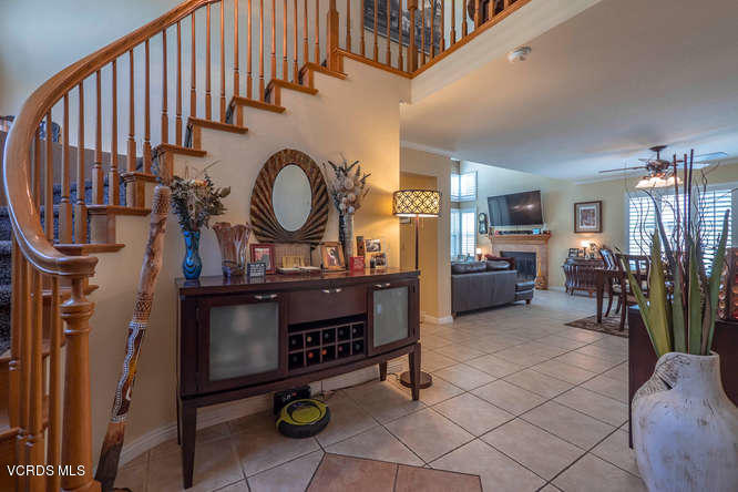 40 Valley Crest Road Simi Valley, CA 93065 - Photo 10 of 38 a living room with furniture a fireplace and a chandelier