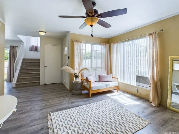 a living room with furniture and a rug