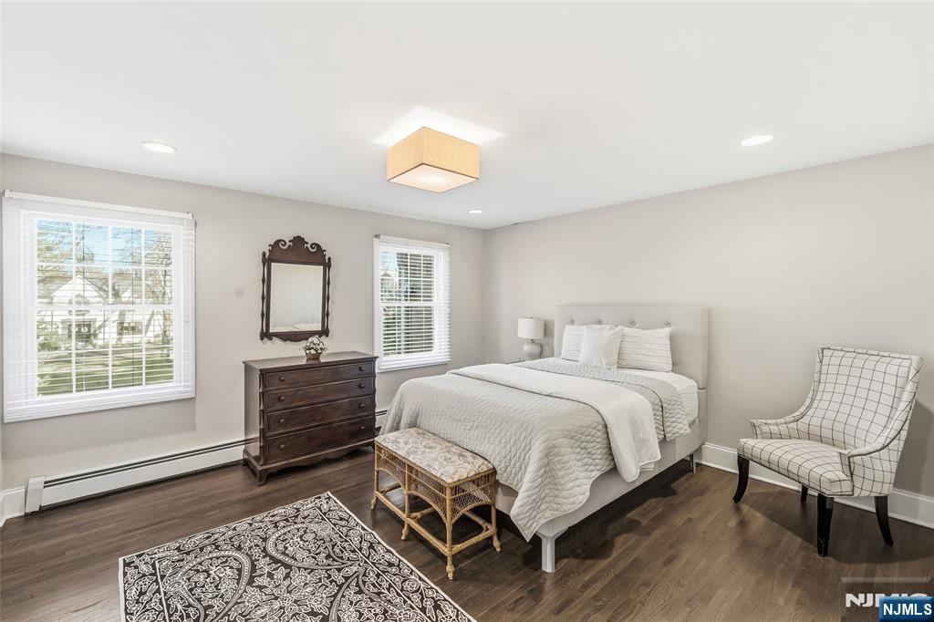 27 Pine Hill Road Old Tappan, NJ 07675 - Photo 41 of 50 a bedroom with a bed windows and chair