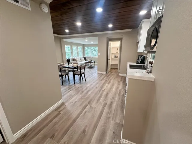 a kitchen with sink and refrigerator
