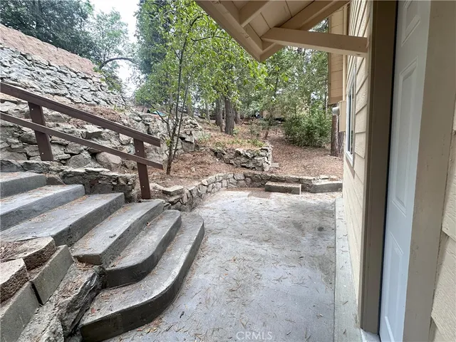 a view of a yard with car parked