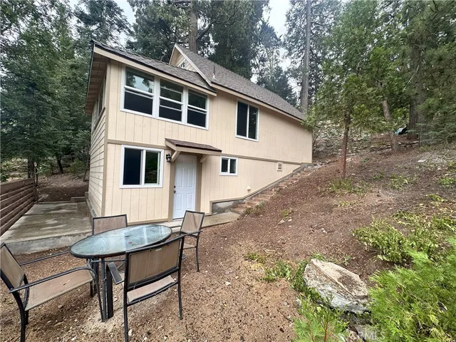 a view of a yard with a house and sitting area