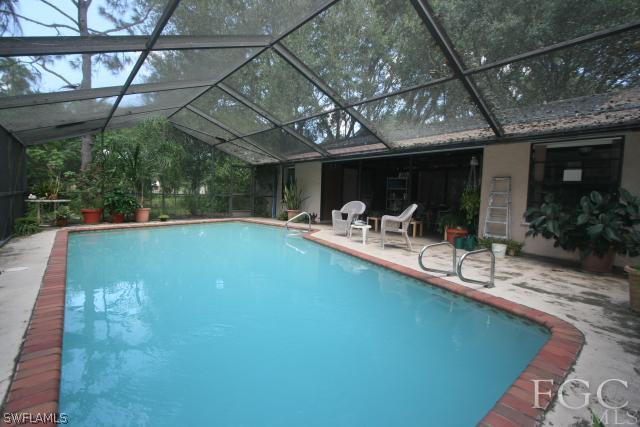 13901 Rod And Gun Club Road Fort Myers, FL 33913 - Photo 14 of 25 a view of a swimming pool with a patio