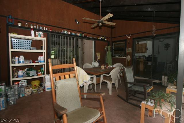 13901 Rod And Gun Club Road Fort Myers, FL 33913 - Photo 16 of 25 a outdoor seating area with a table and chairs
