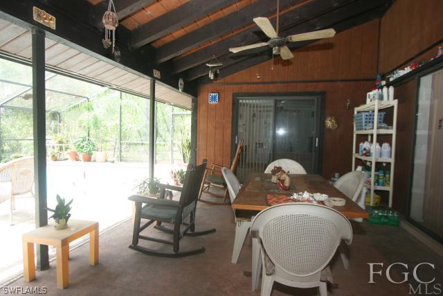 13901 Rod And Gun Club Road Fort Myers, FL 33913 - Photo 17 of 25 a living room with furniture and a window