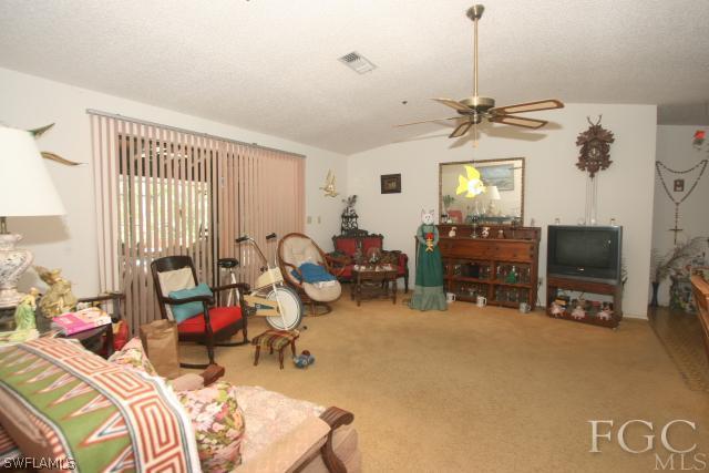13901 Rod And Gun Club Road Fort Myers, FL 33913 - Photo 19 of 25 a bedroom with furniture and a window