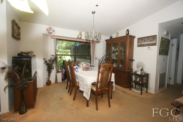 13901 Rod And Gun Club Road Fort Myers, FL 33913 - Photo 20 of 25 a view of a dining room with furniture window and outside view