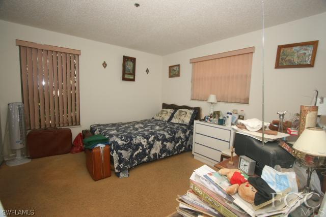 13901 Rod And Gun Club Road Fort Myers, FL 33913 - Photo 22 of 25 a living room with furniture and a window