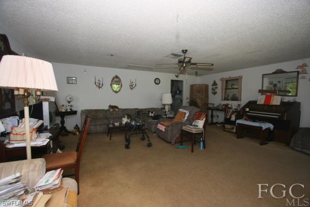 13901 Rod And Gun Club Road Fort Myers, FL 33913 - Photo 25 of 25 a living room with furniture and a large window