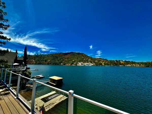 a bedroom with a bed and glass door