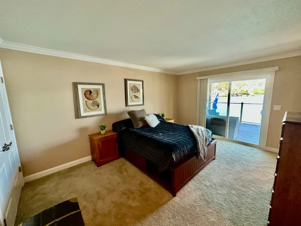 a bathroom with double vanity sinks a shower and a mirror