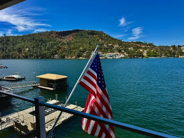 a view of a lake with a house in the background