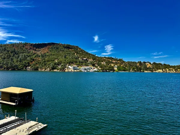 a view of a balcony with chair and dryer
