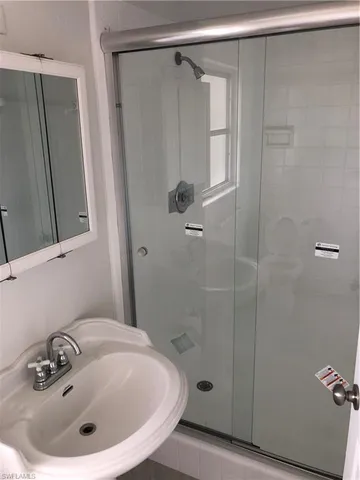 a kitchen sink sitting next to a window