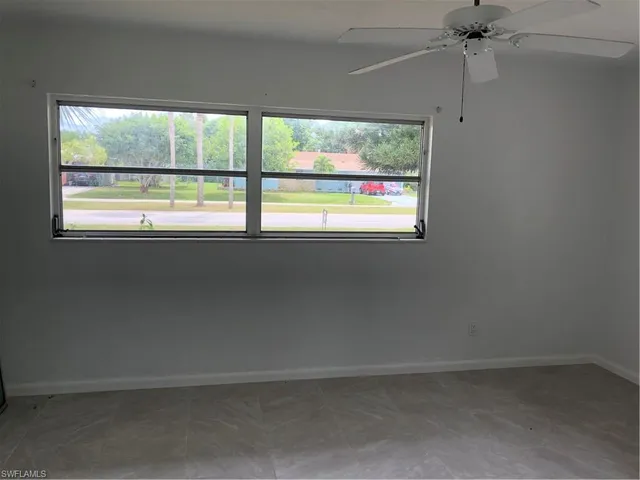 a kitchen with a refrigerator and a sink