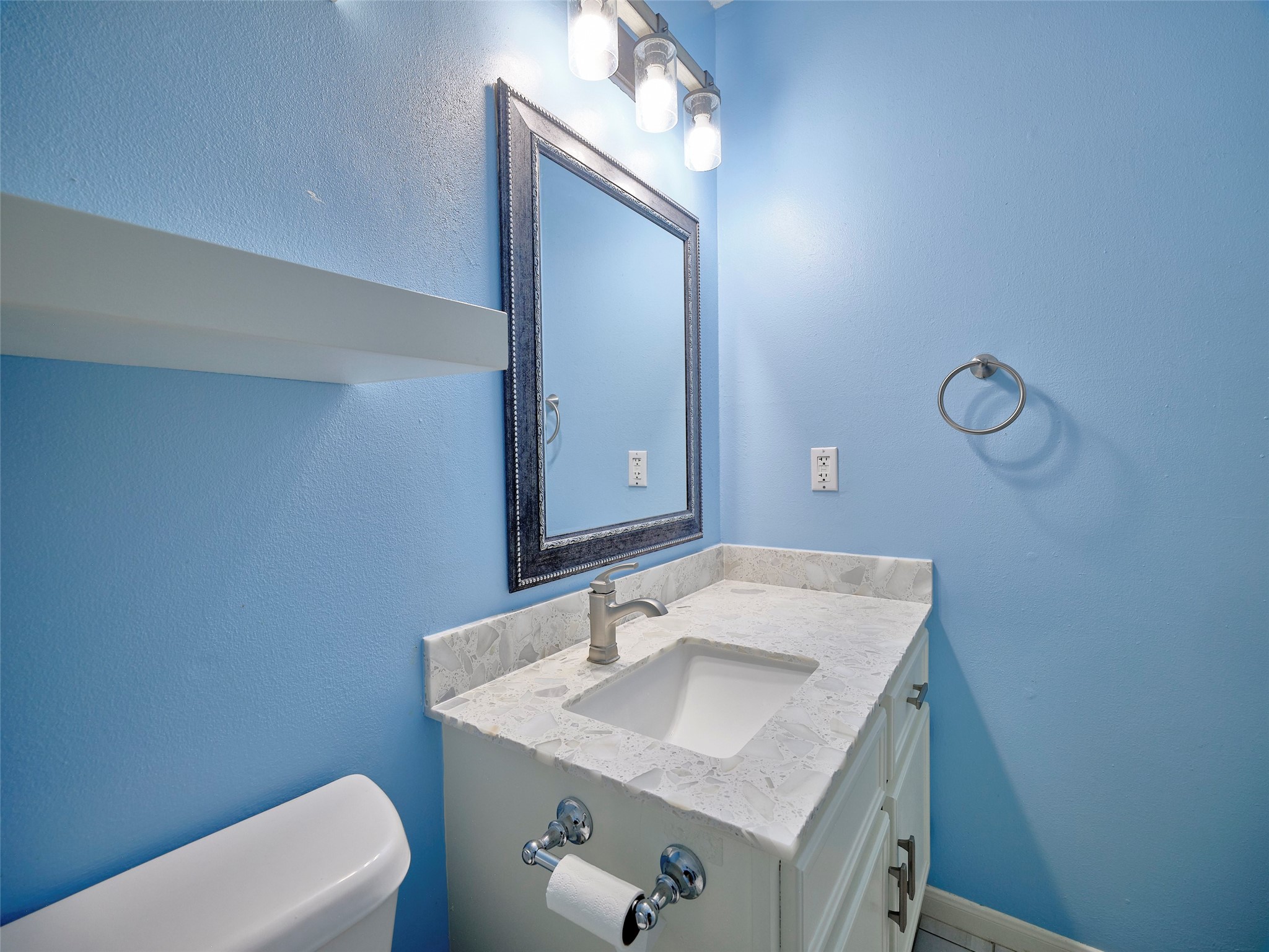 1520 Crestmont Street Wharton, TX 77488 - Photo 19 of 38 a bathroom with a sink toilet and mirror