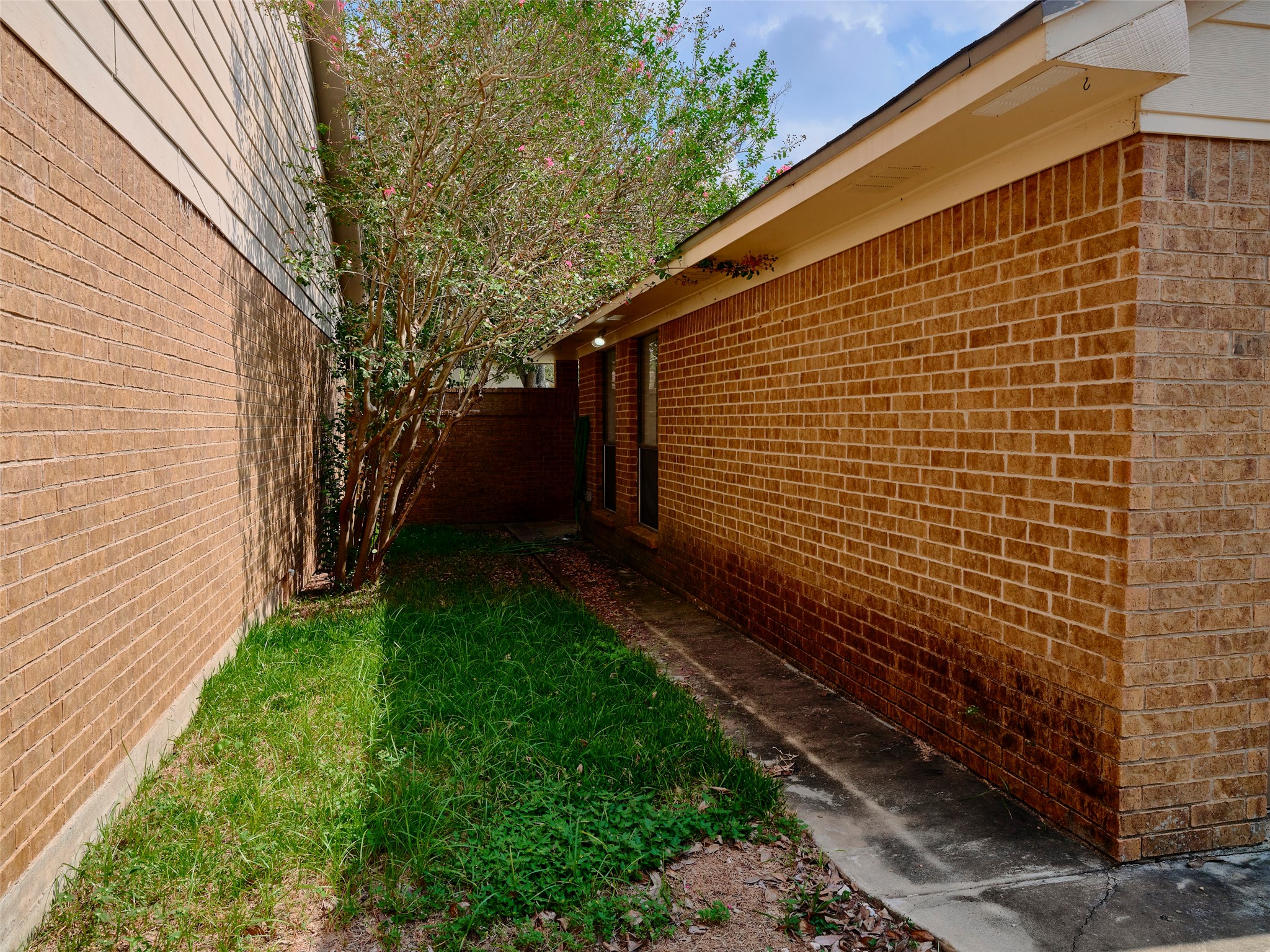 1520 Crestmont Street Wharton, TX 77488 - Photo 36 of 38 a view of a backyard with pathway