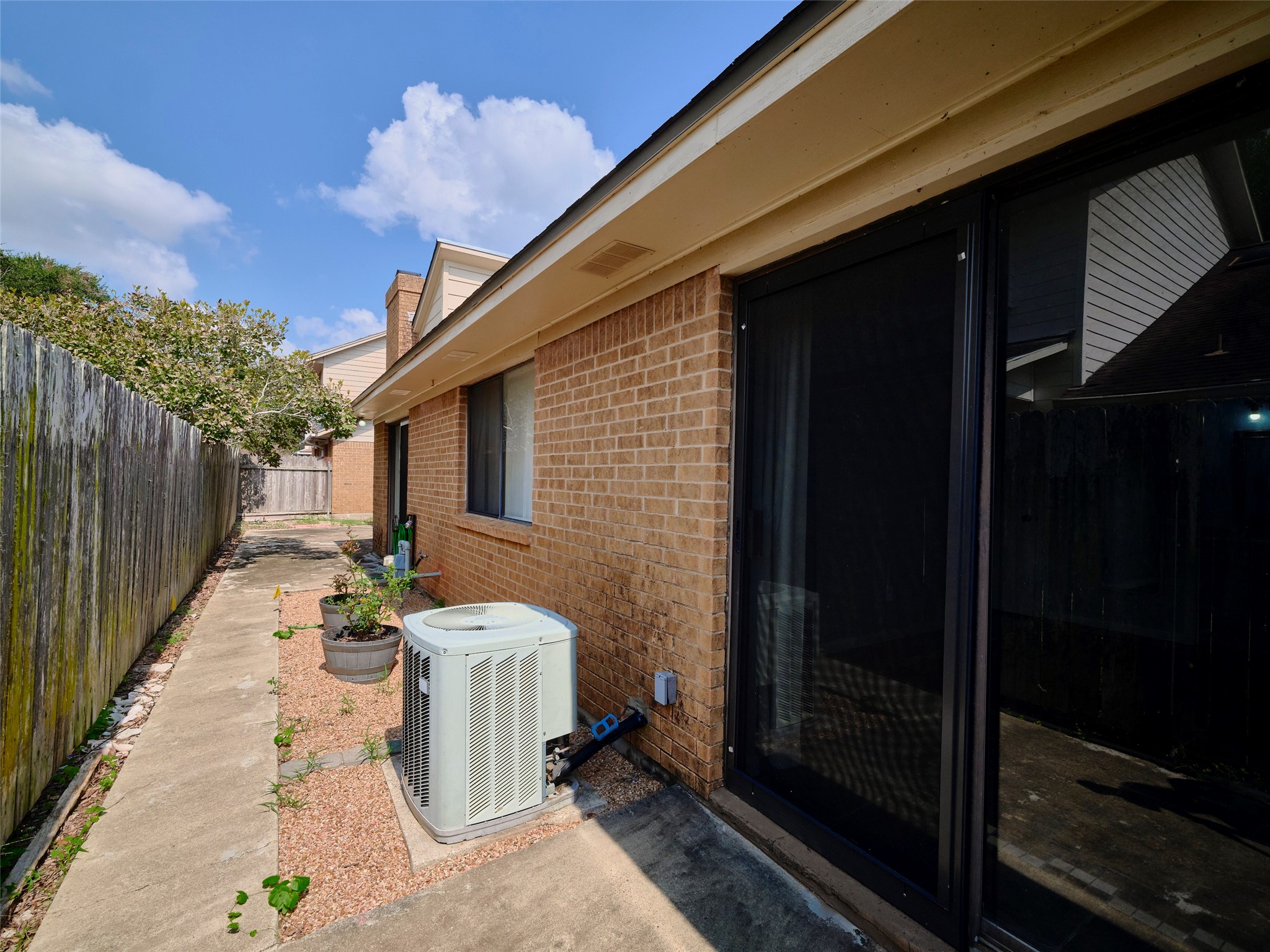 1520 Crestmont Street Wharton, TX 77488 - Photo 38 of 38 a view of a patio with table and chairs with wooden fence